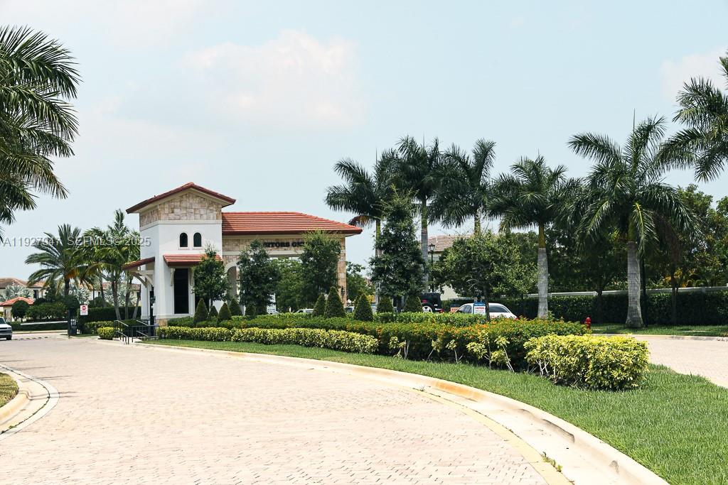 3434 West 104th Terrace Hialeah, FL 33018 - Photo 15 of 28 a front view of a house with a garden