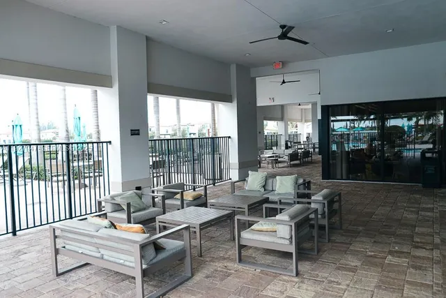 a view of swimming pool with outdoor seating