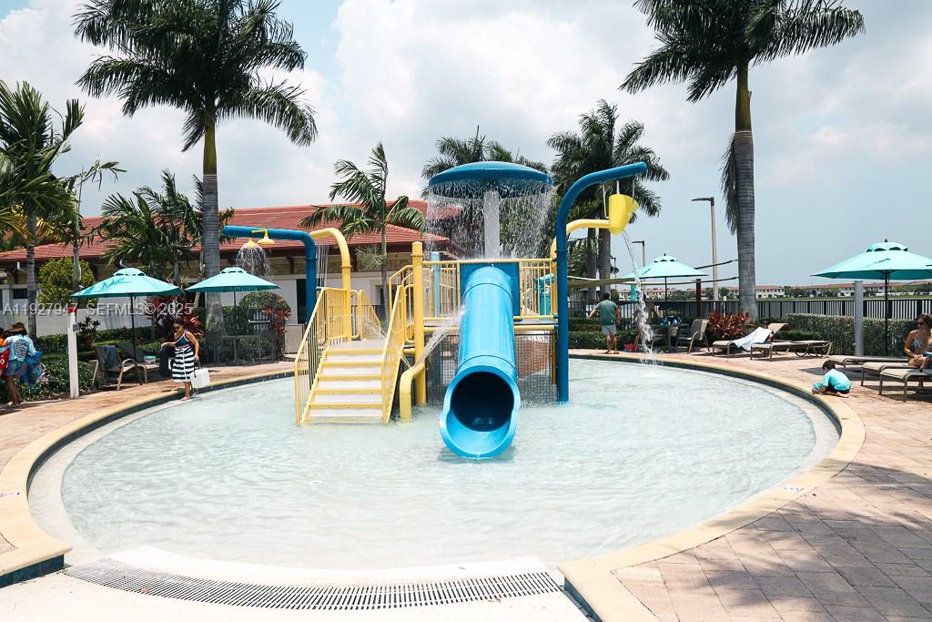 3434 West 104th Terrace Hialeah, FL 33018 - Photo 19 of 28 a view of swimming pool with outdoor seating