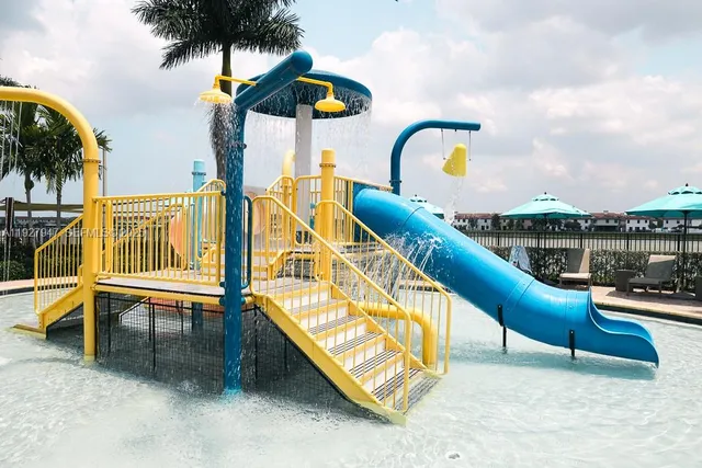 a patio with a table and chairs and potted plants