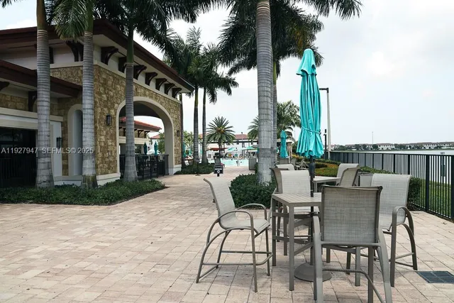 a view of a swimming pool with a table and chairs