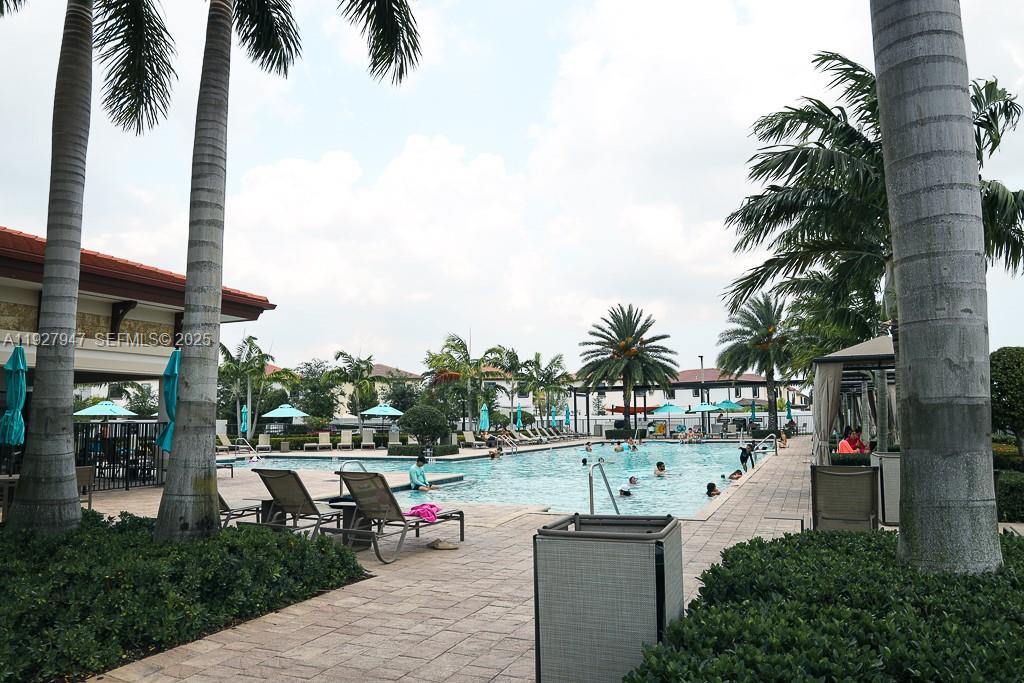 3434 West 104th Terrace Hialeah, FL 33018 - Photo 23 of 28 aerial view of a house with a swimming pool and sitting area