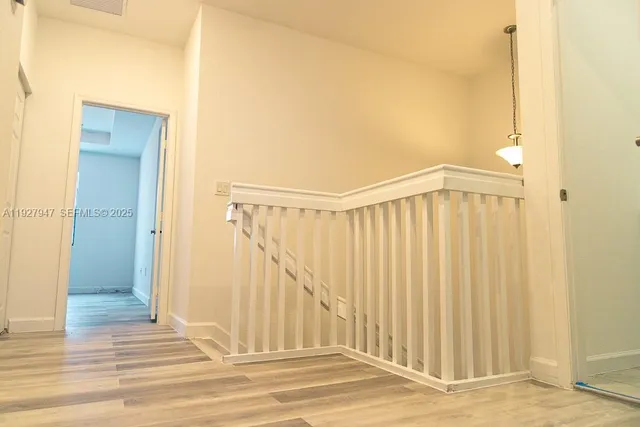 a view of a entryway with wooden floor