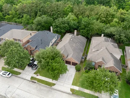 an aerial view of a house with a garden