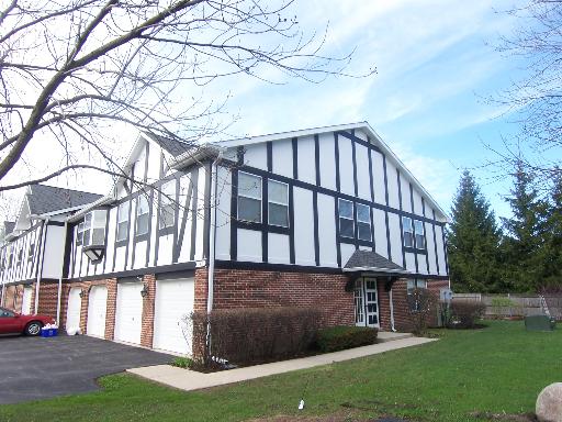 146 West Golf Road, Unit C Libertyville, IL 60048 - Photo 1 of 24 a view of building with yard