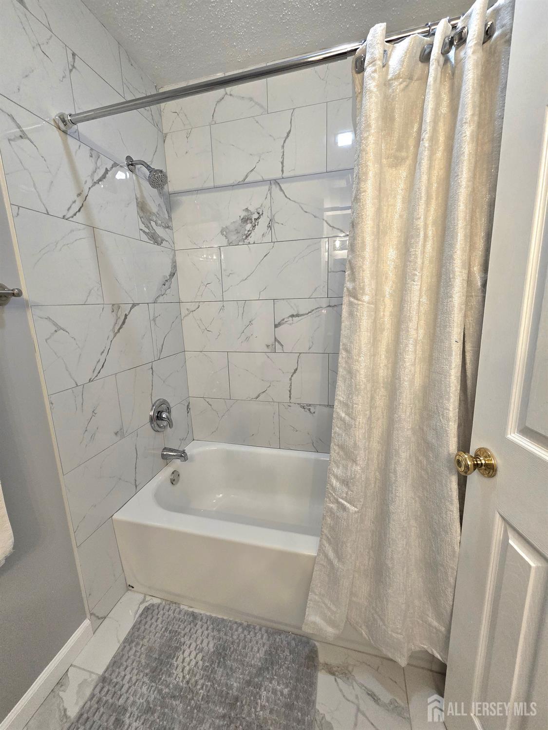 124 Howell Avenue Fords, NJ 08863 - Photo 14 of 23 a bathroom with a bathtub and shower