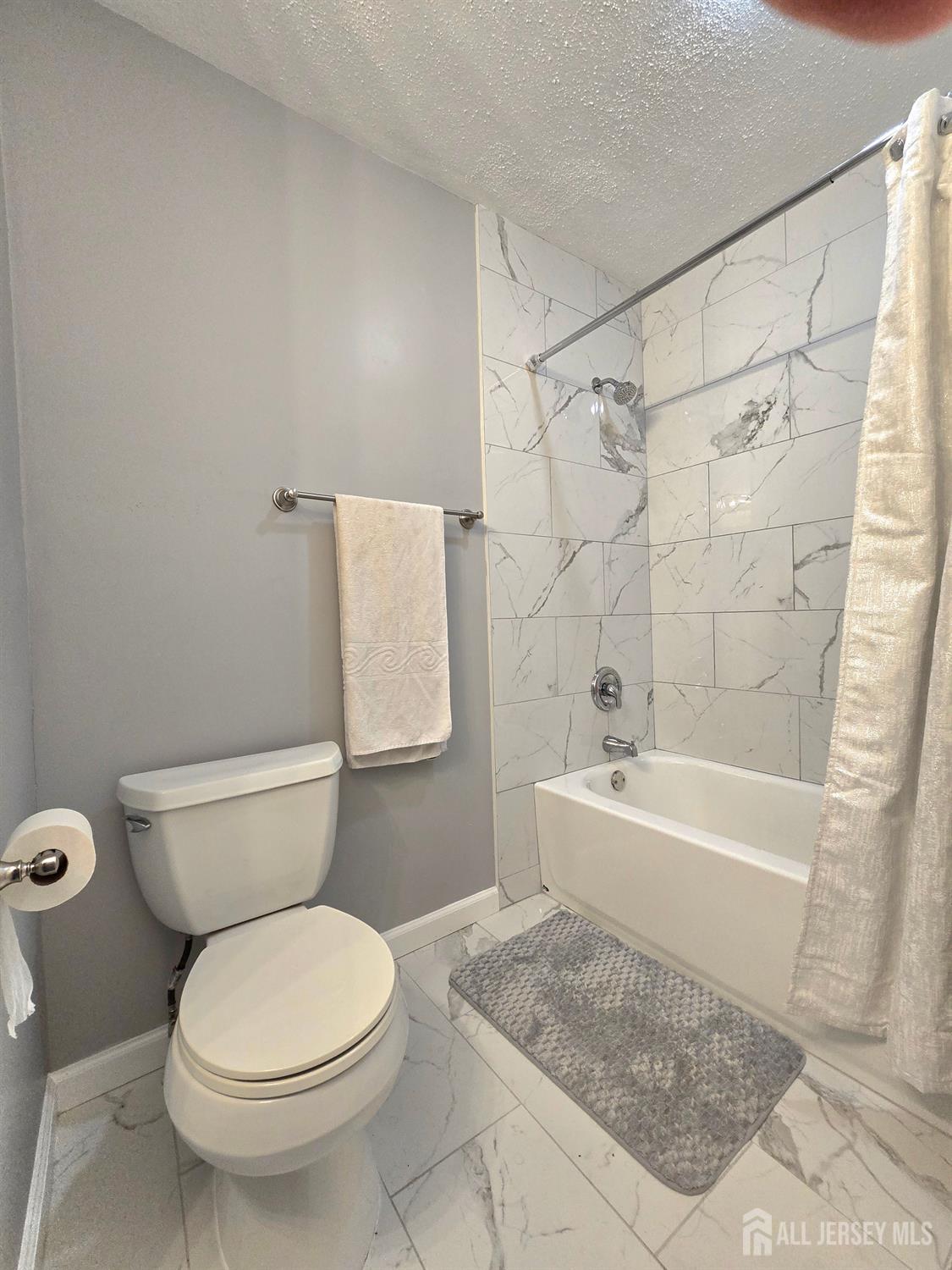 124 Howell Avenue Fords, NJ 08863 - Photo 15 of 23 a bathroom with a sink a toilet and shower
