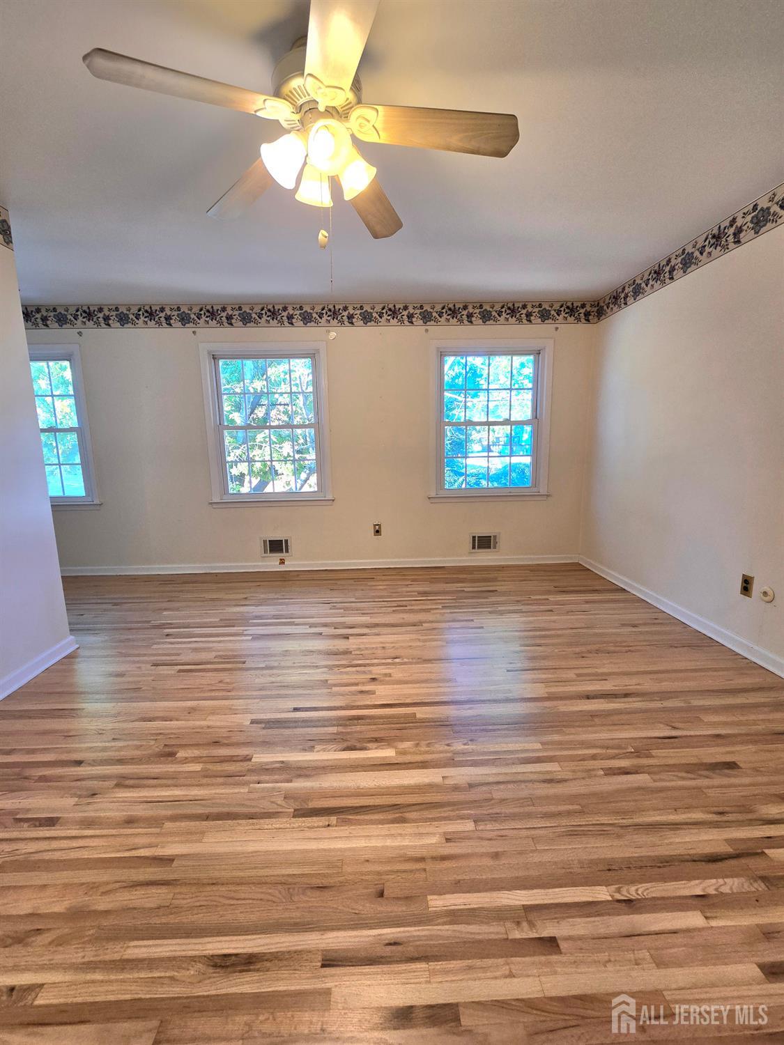 124 Howell Avenue Fords, NJ 08863 - Photo 8 of 23 a view of room with window and ceiling fan
