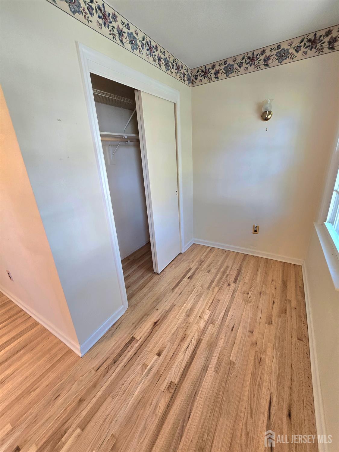 124 Howell Avenue Fords, NJ 08863 - Photo 10 of 23 a view of empty room with wooden floor