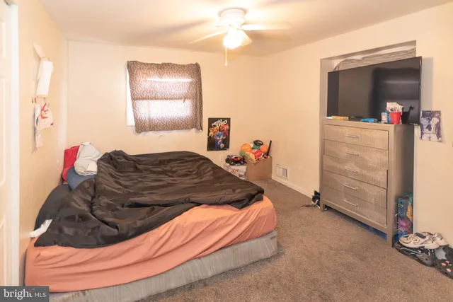 a bed room with a bed and a mirror