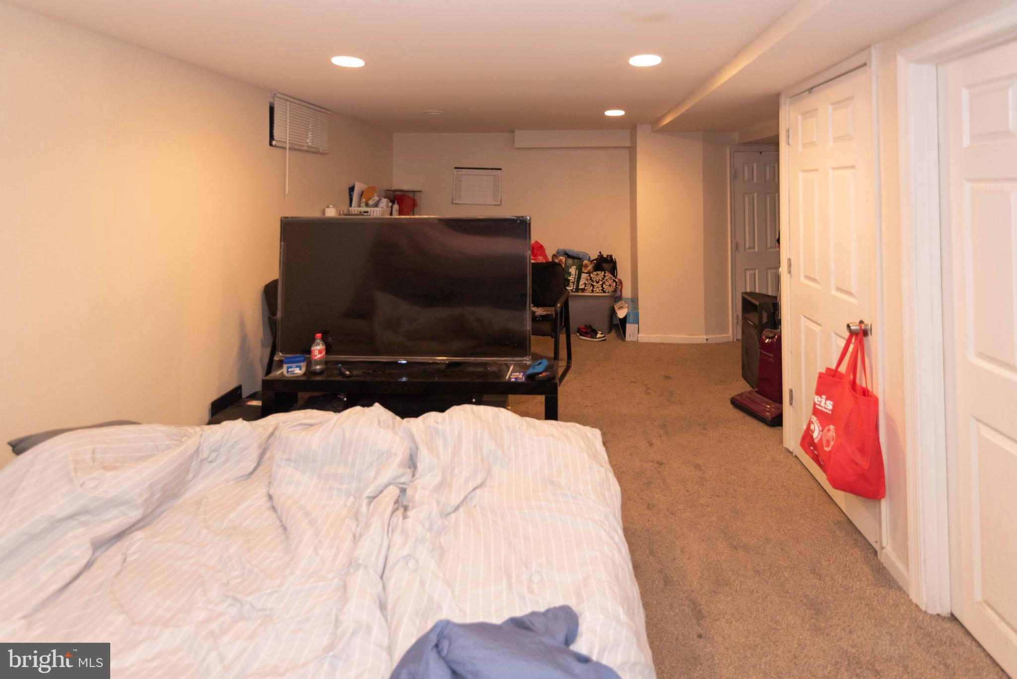 5686 Utrecht Road Baltimore, MD 21206 - Photo 26 of 35 a bed room with a bed and a television