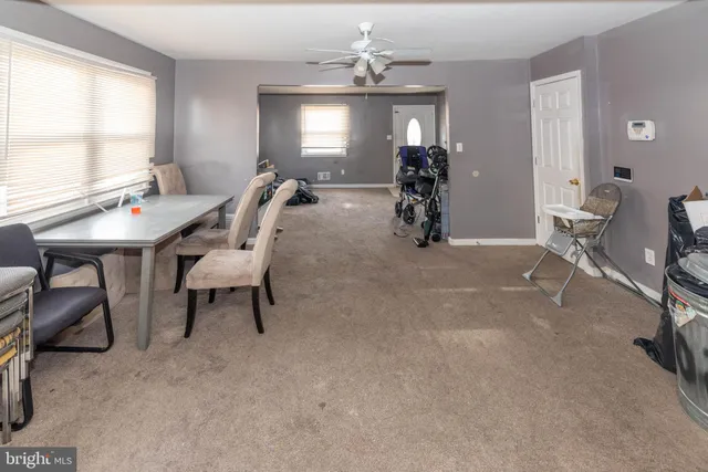 a view of a livingroom with furniture and window