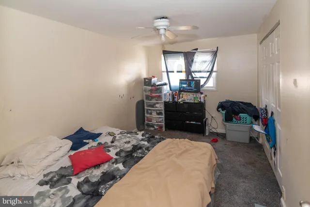 a bedroom with bed and a window