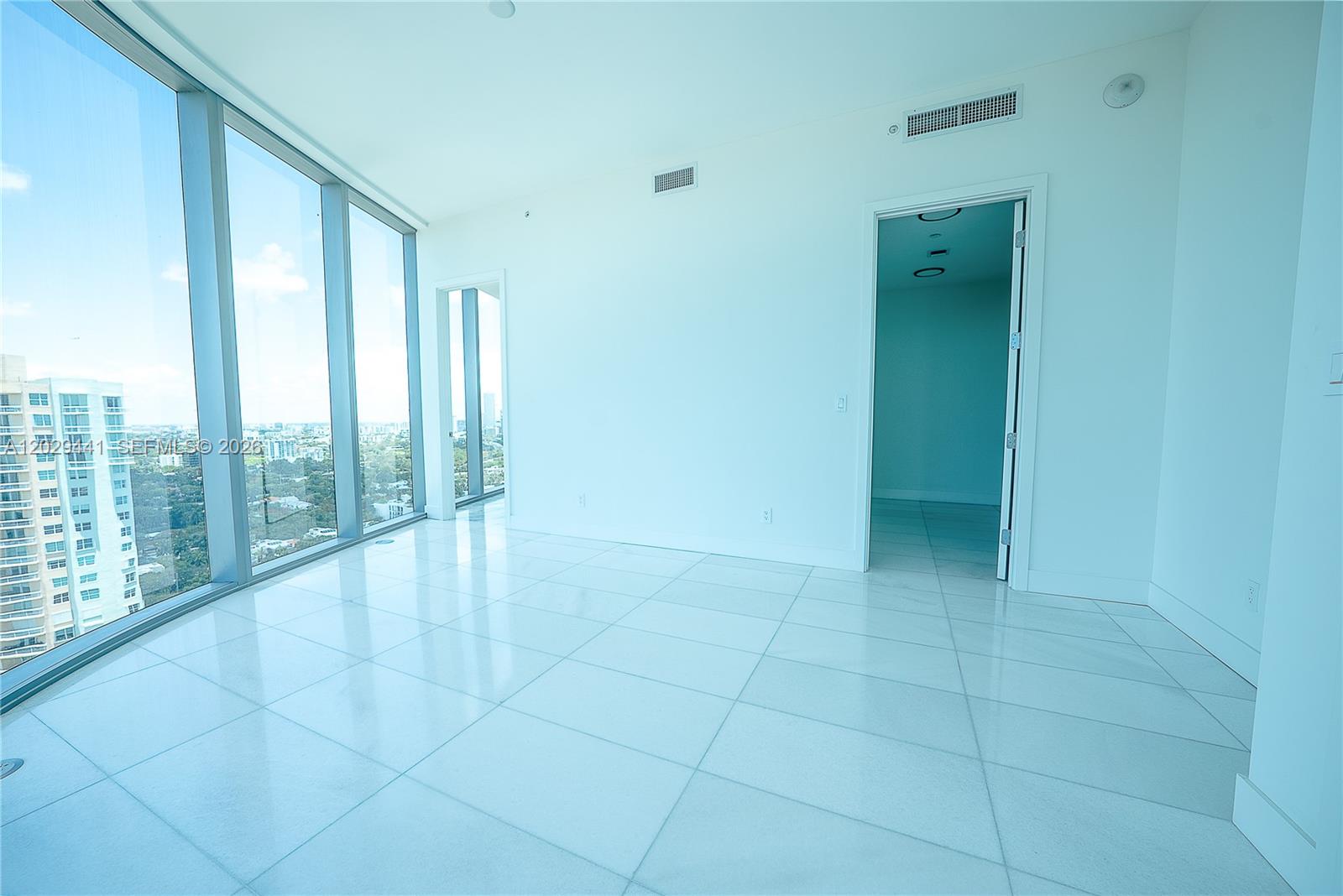 175 Southeast 25th Road, Unit 2103 Miami, FL 33129 - Photo 20 of 27 a view of an empty room and window