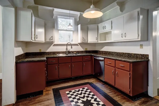 a kitchen with stainless steel appliances granite countertop a sink stove and cabinets