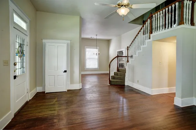 a view of an entryway with wooden floor