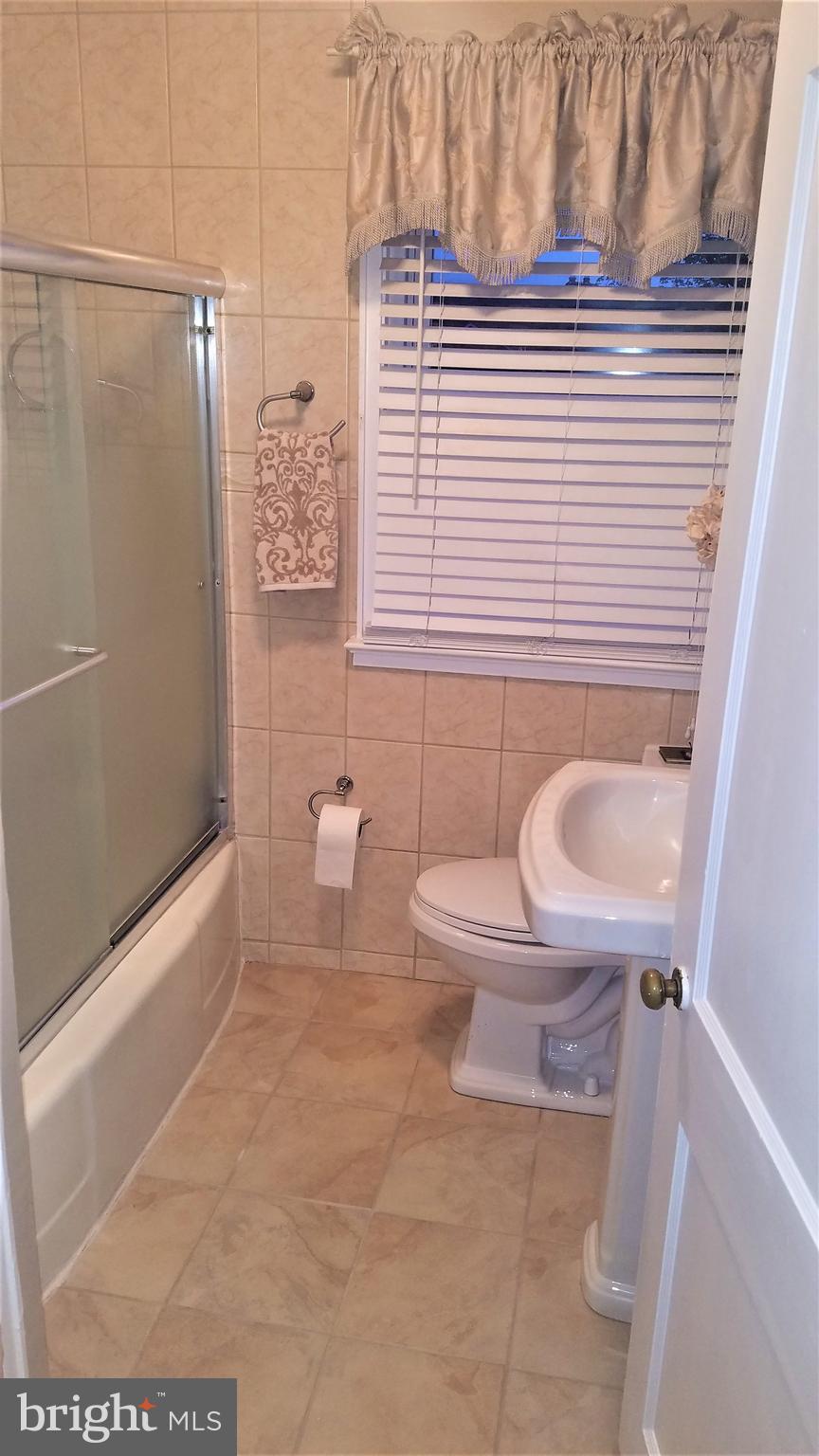 1918 Hillenwood Road Baltimore, MD 21239 - Photo 27 of 41 Updated tile work in main bathroom