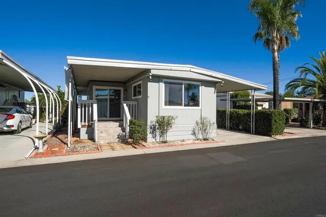 a front view of a house with a outdoor space