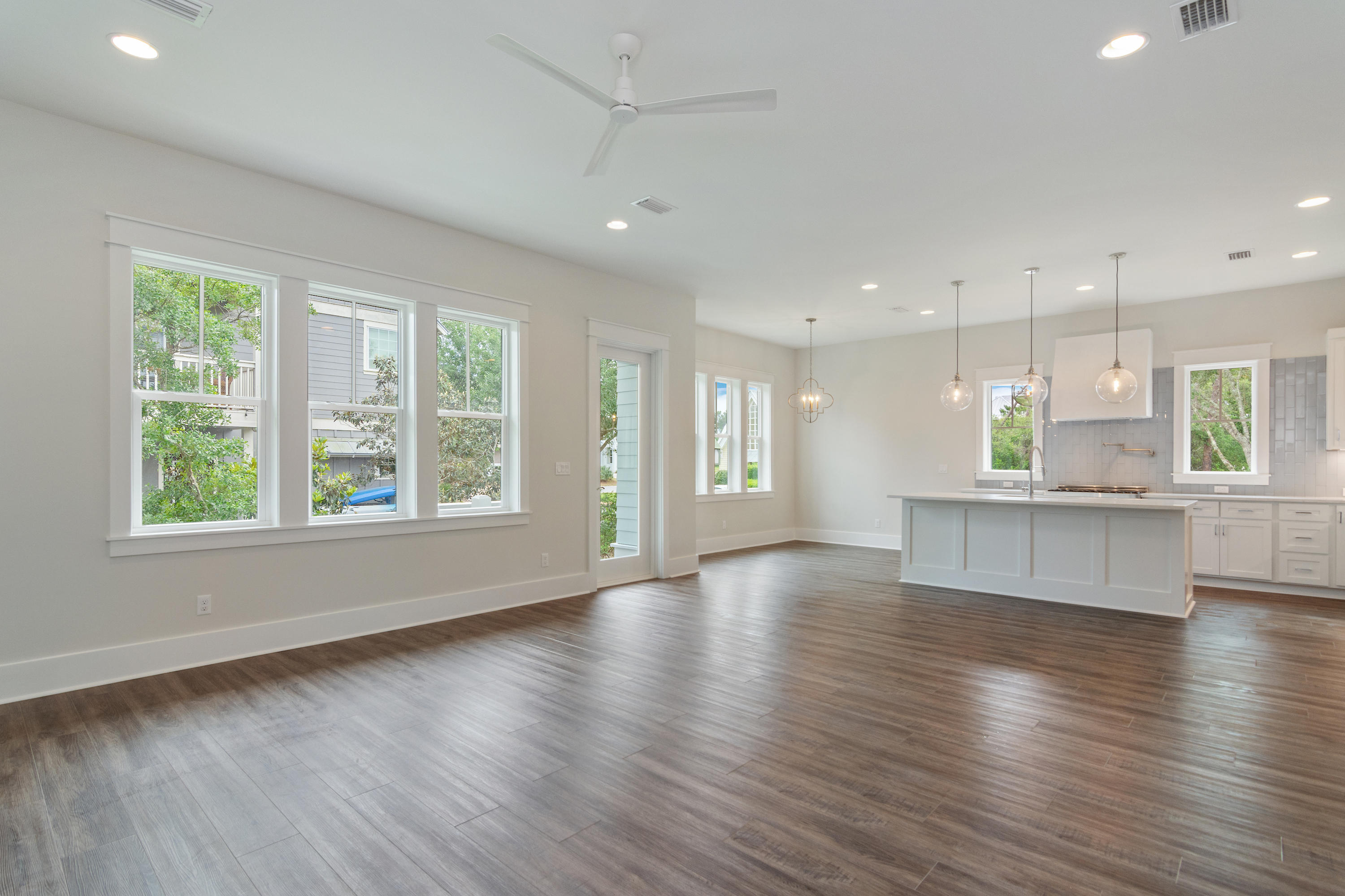 16 Lake Mist Ln Inlet Beach Inlet Beach, FL 32461 - Photo 2 of 45 a view of an empty room with wooden floor and a window