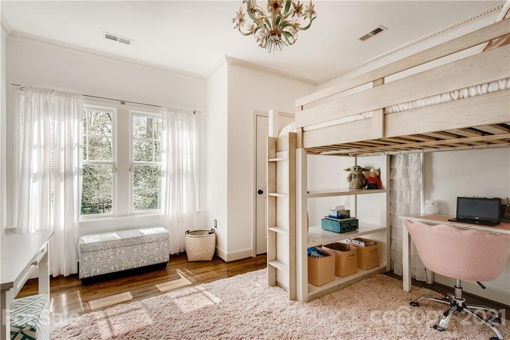 3929 Glenfall Avenue Charlotte, NC 28210 - Photo 22 of 30 a bedroom with furniture and a window