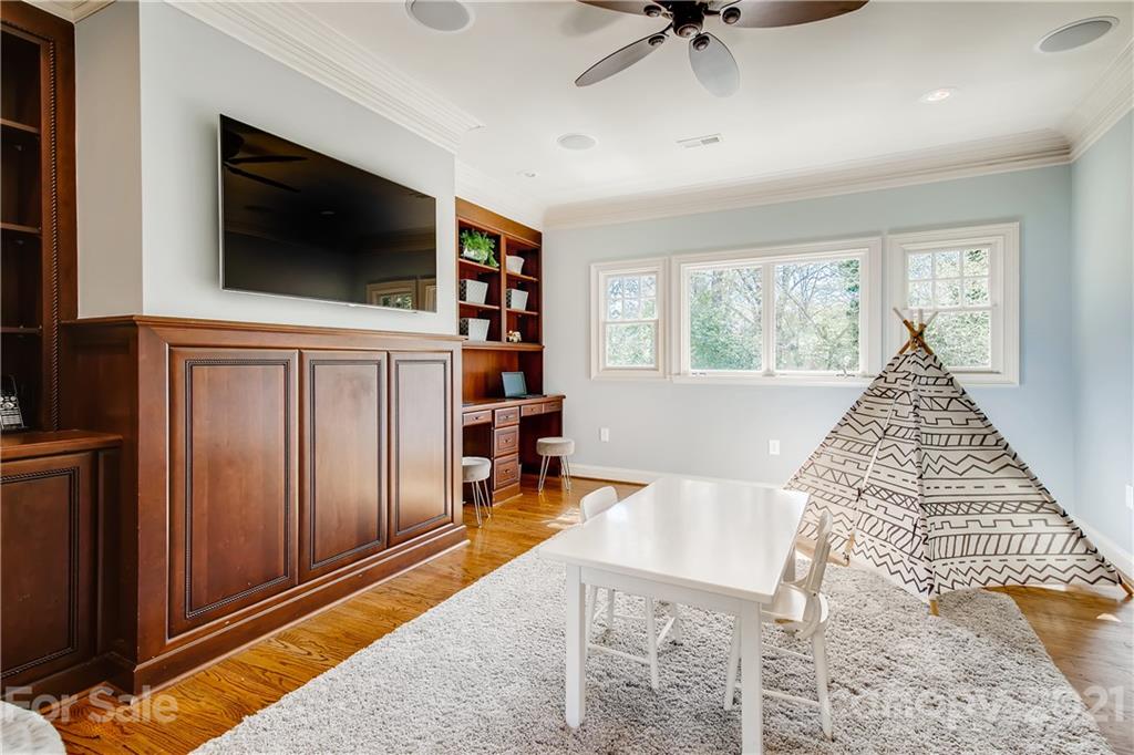 3929 Glenfall Avenue Charlotte, NC 28210 - Photo 25 of 30 a living room with furniture and a flat screen tv