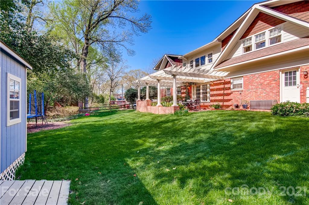 3929 Glenfall Avenue Charlotte, NC 28210 - Photo 29 of 30 a front view of a house with a yard table and chairs
