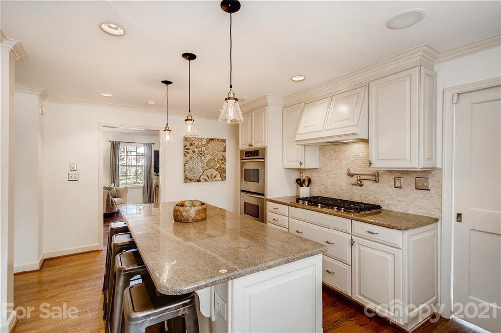 3929 Glenfall Avenue Charlotte, NC 28210 - Photo 8 of 30 a kitchen with white cabinets and white appliances