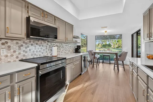 a view of a dining room with furniture window and outside view