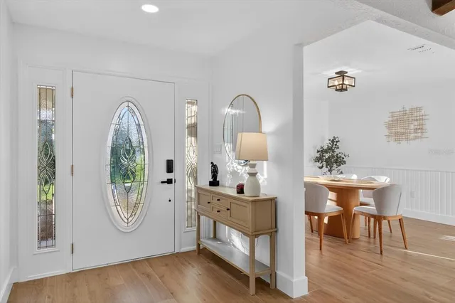 a view of living room filled with furniture and wooden floor