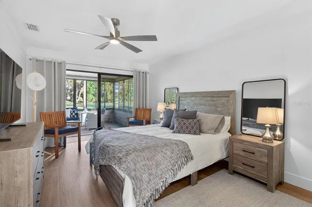 a bedroom with a bed and a mirror