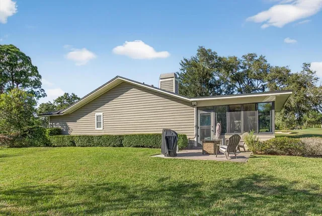 an aerial view of residential house with outdoor space