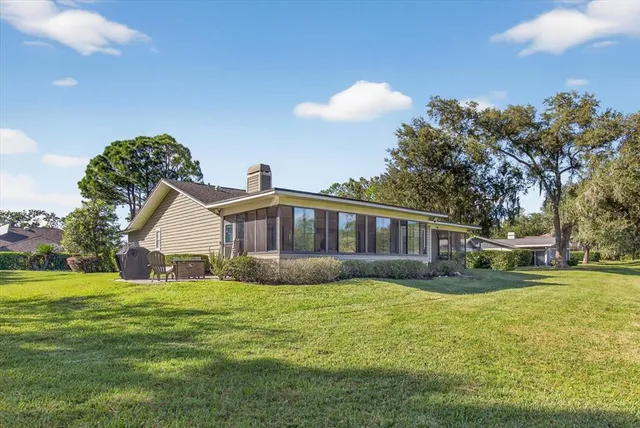 an aerial view of house with yard swimming pool and mountains