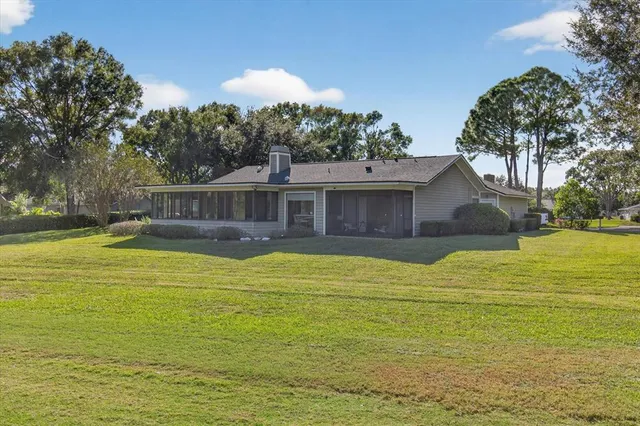 an aerial view of a houses with a yard