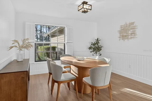 a dining room with furniture and window