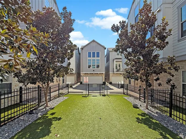a view of a house with swimming pool and sitting area