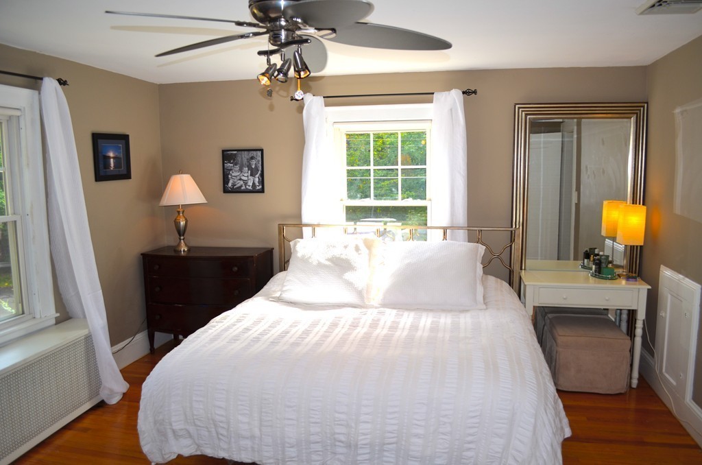 425 Trafton Road Springfield, MA 01108 - Photo 24 of 28 a bedroom with a bed and wooden floor