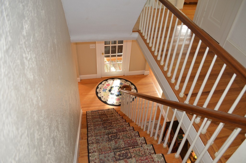 425 Trafton Road Springfield, MA 01108 - Photo 27 of 28 a view of a hallway with wooden floor and a front door