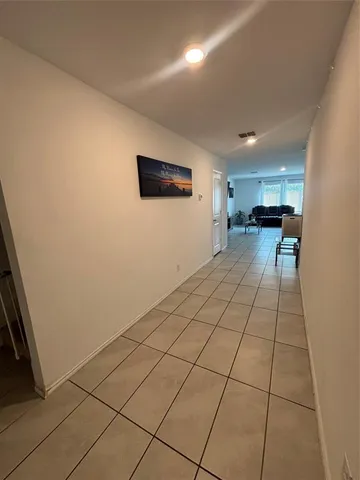 a view of a livingroom with furniture and a window