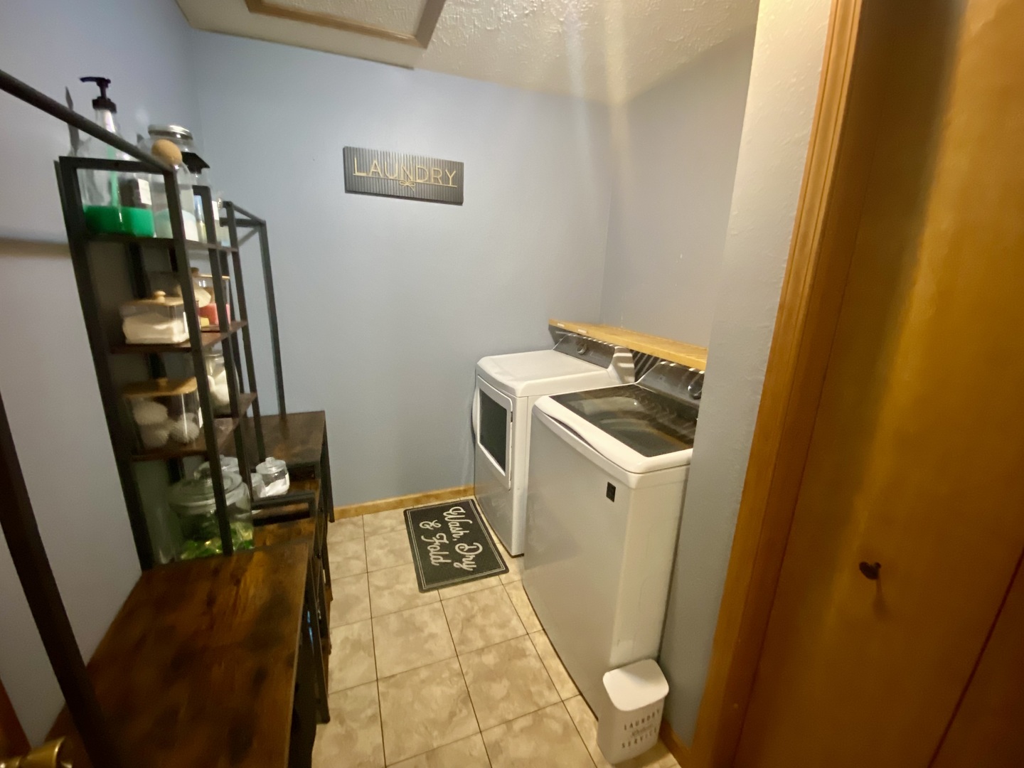 7645 Noltings Road Centralia, IL 62801 - Photo 13 of 18 a view of utility room with fridge and wooden floor