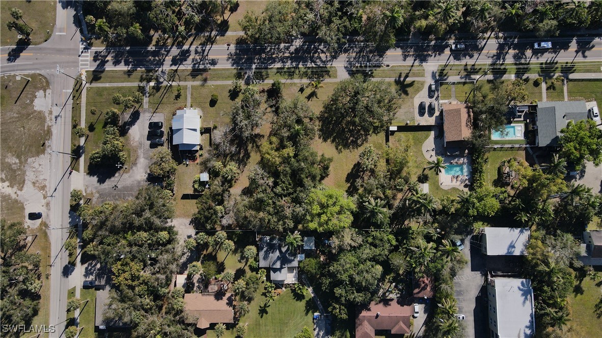 2nd Street Fort Myers, FL 33916 - Photo 4 of 12 an aerial view of residential house with outdoor space and trees all around