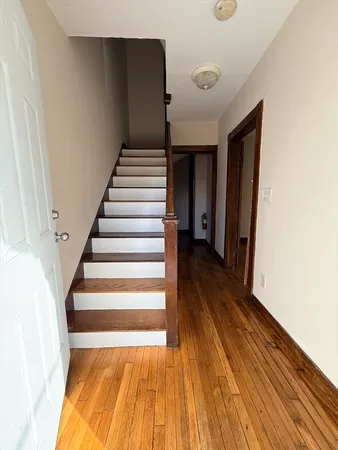 a view of entryway with wooden floor