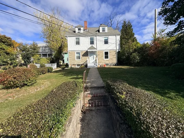 a view of a yard with iron fence