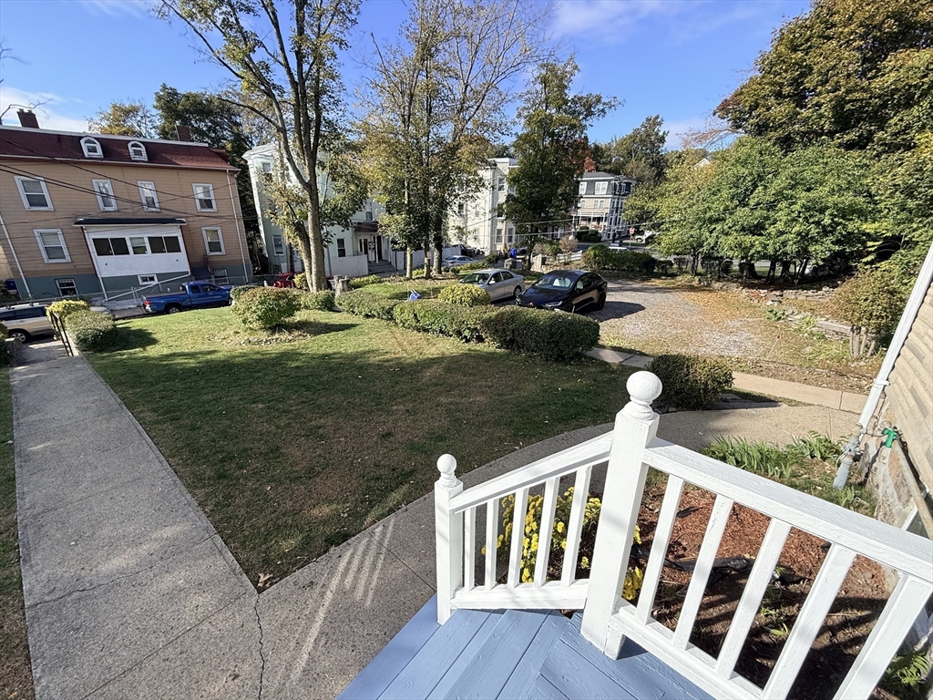 5 Oakland Street, Unit 1 Boston, MA 02119 - Photo 22 of 25 a view of a yard with iron fence