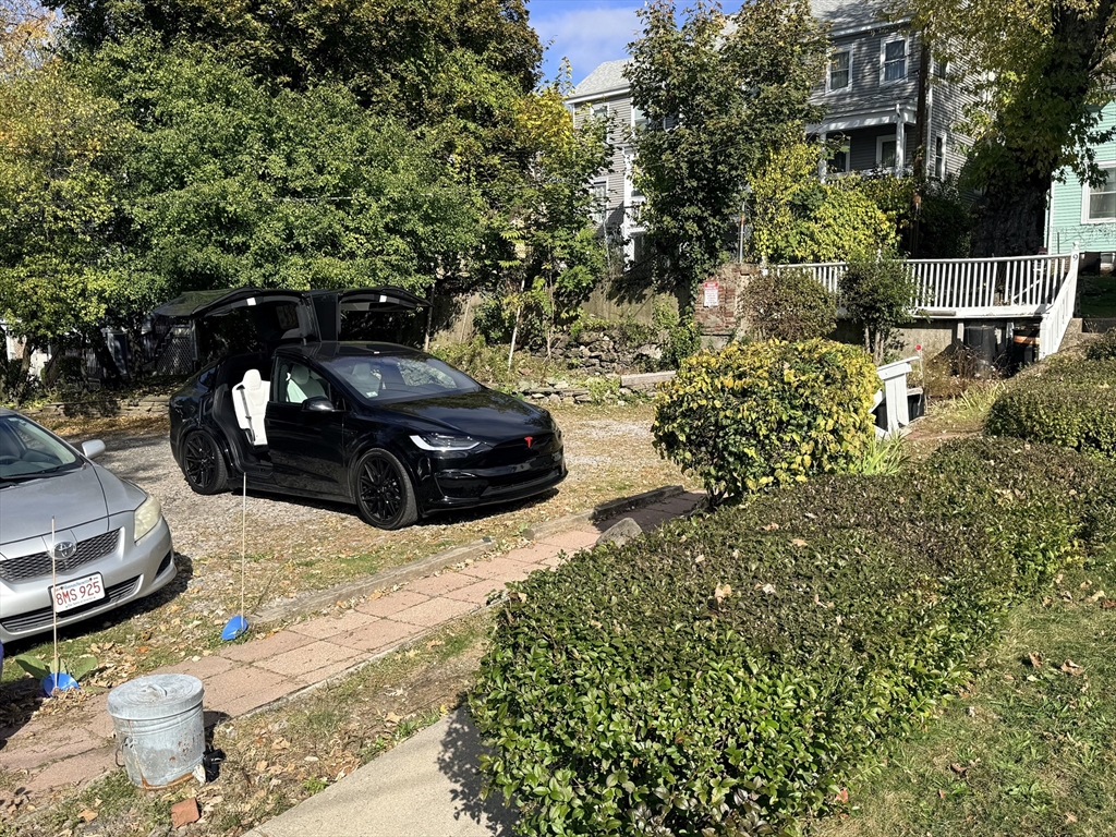 5 Oakland Street, Unit 1 Boston, MA 02119 - Photo 23 of 25 a view of a back yard of the house