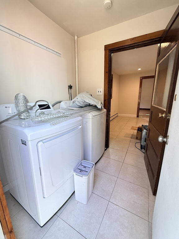 5 Oakland Street, Unit 1 Boston, MA 02119 - Photo 8 of 25 a utility room with washer and dryer
