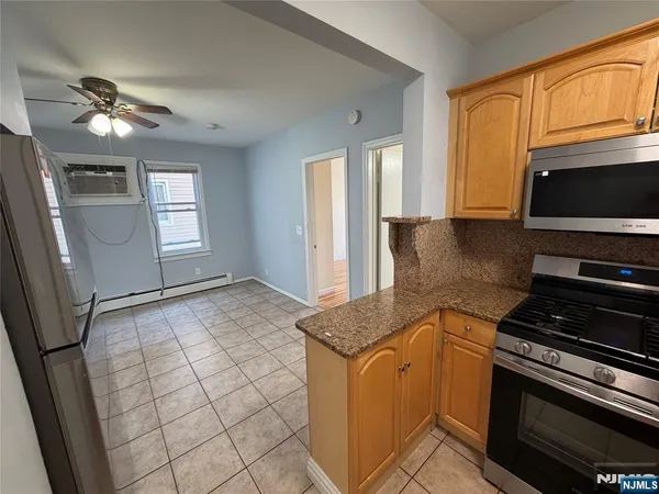 a kitchen with a stove and a microwave