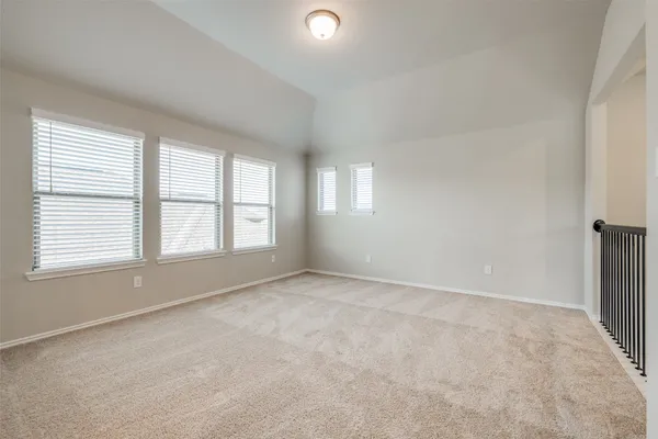 a view of an empty room with windows