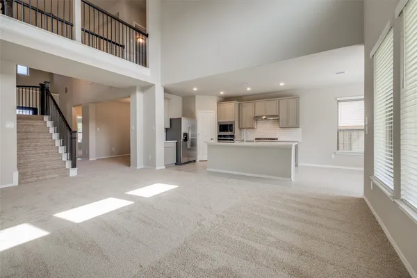 a kitchen with stainless steel appliances granite countertop a refrigerator sink and cabinets