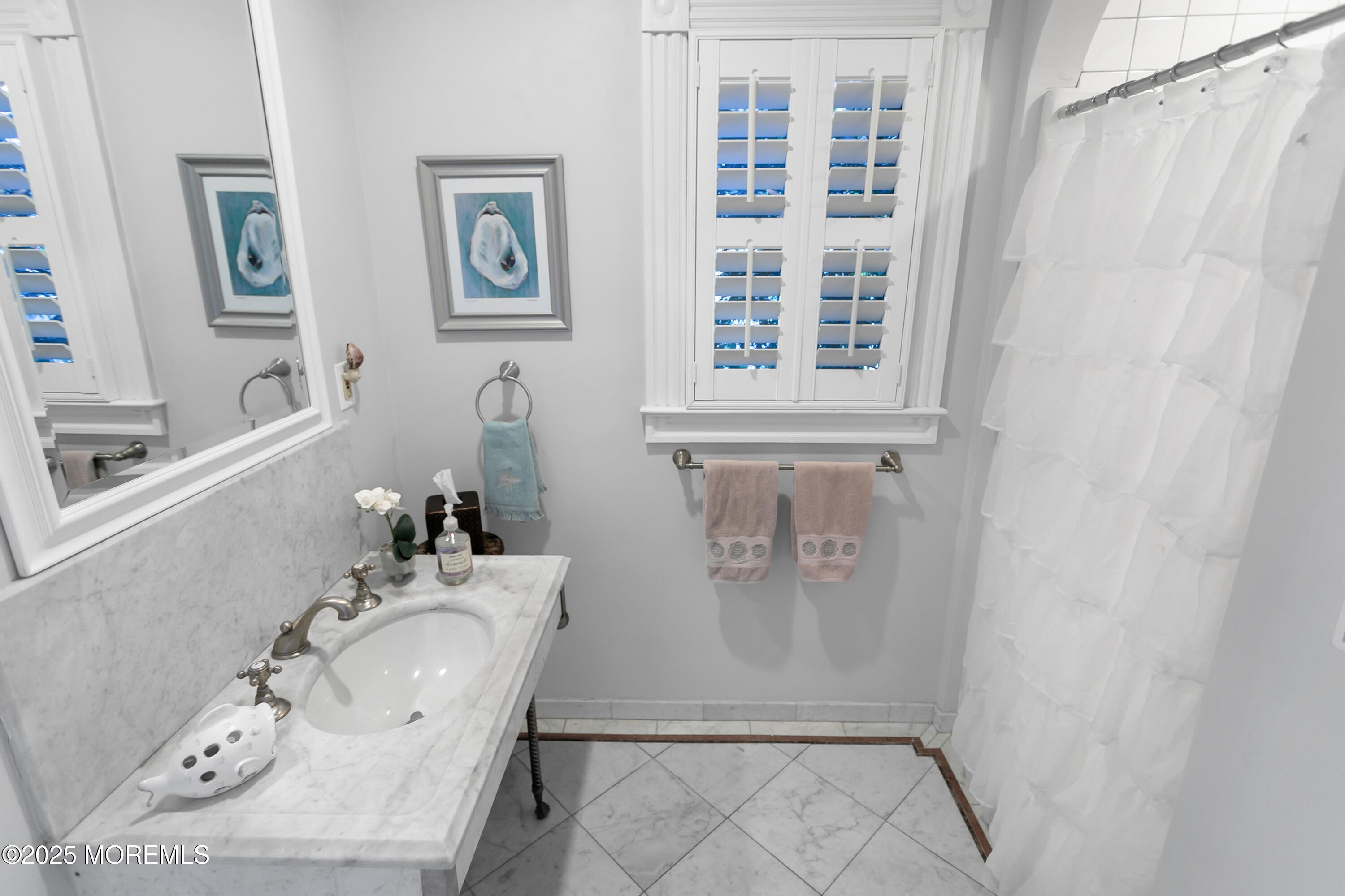7 Allen Street Rumson, NJ 07760 - Photo 18 of 45 a bathroom with a sink and a window