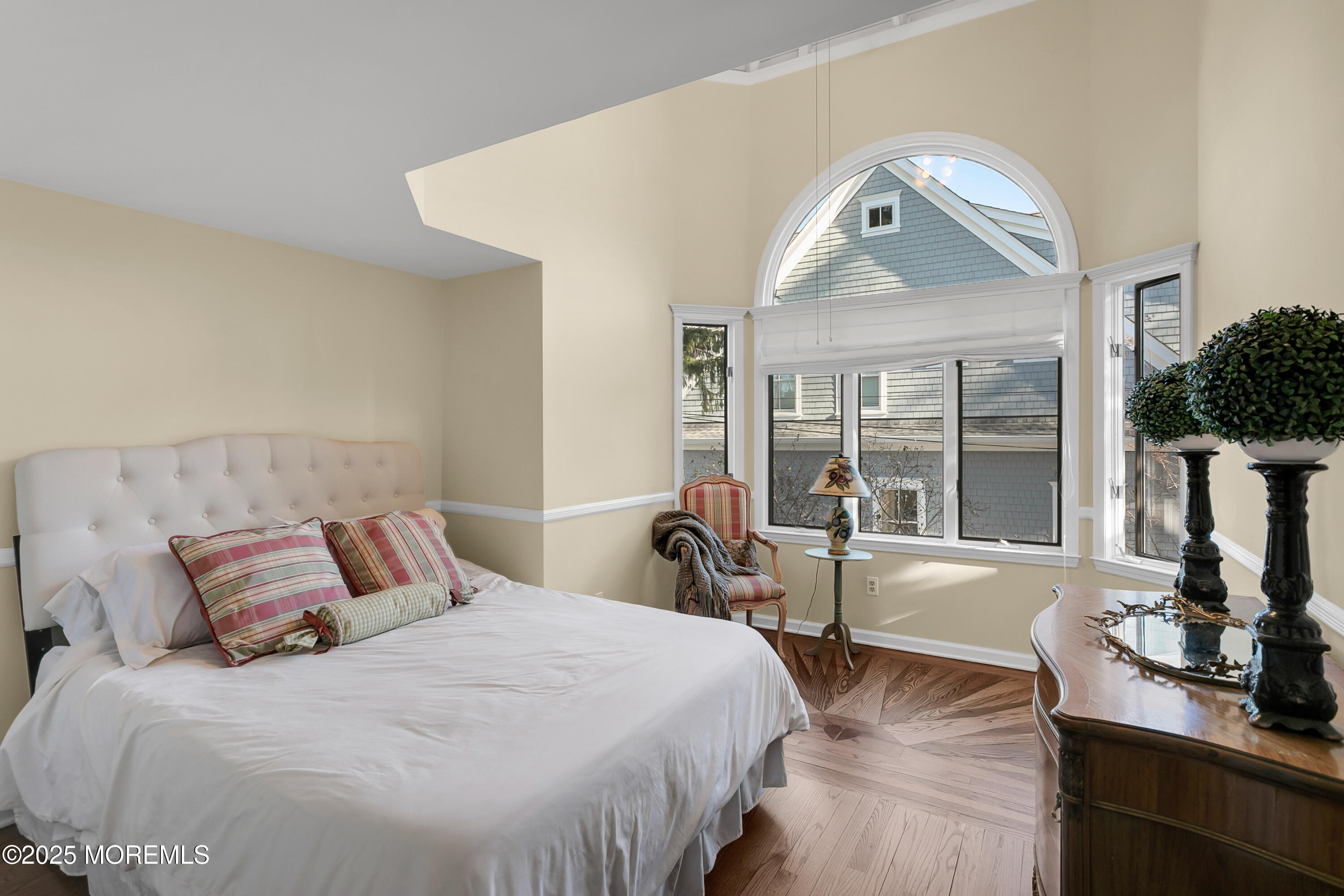 7 Allen Street Rumson, NJ 07760 - Photo 29 of 45 a bedroom with a large bed and a large window